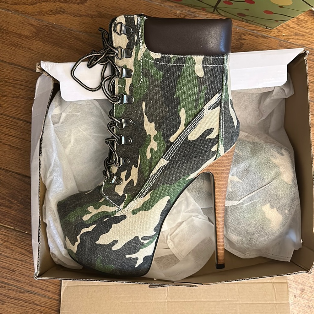 Brand new, never tried on camo platform booties.